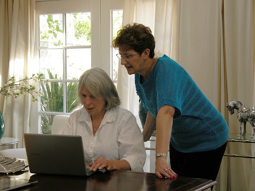 Two women working at a computer